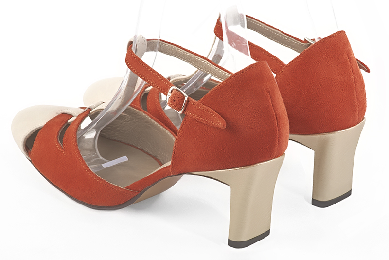 Off white and terracotta orange women's T-strap open side shoes. Round toe. Medium comma heels. Rear view - Florence KOOIJMAN
